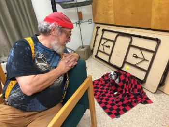 Wiscasset Planning Board member Al Cohen speaks with his Boston terrier Miss Lilly before the start of the board’s Aug. 31 meeting at the municipal building. SUSAN JOHNS/Wiscasset Newspaper Al Cohen, Big Al, Boston terrier, Wiscasset Planning Board