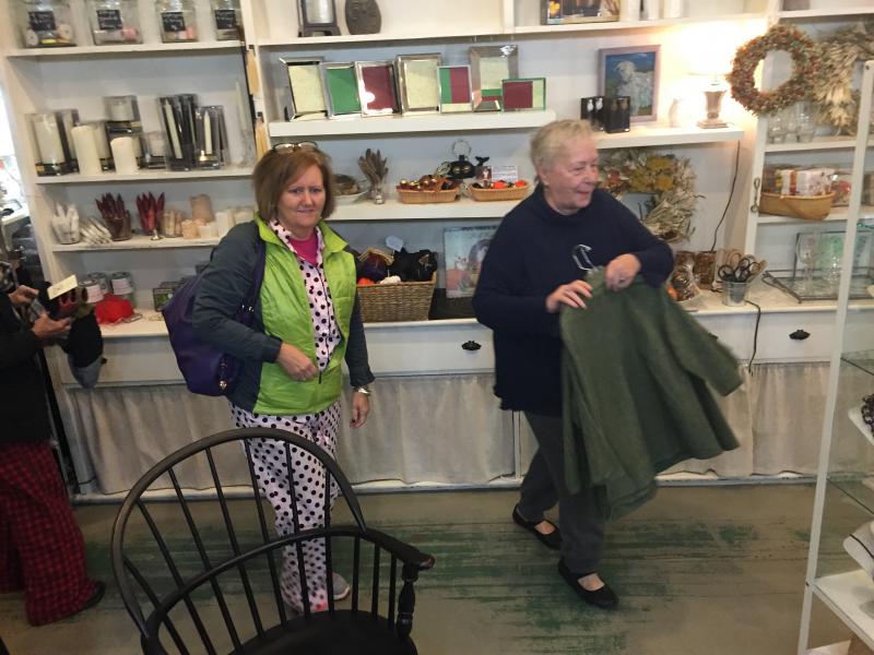 Shopper Pam Underwood of West Bath and DebraElizabeth’s owner Deb Schaffer stay on the move at the Main Street store predawn Saturday, Nov. 14. SUSAN JOHNS/Wiscassst Newspaper