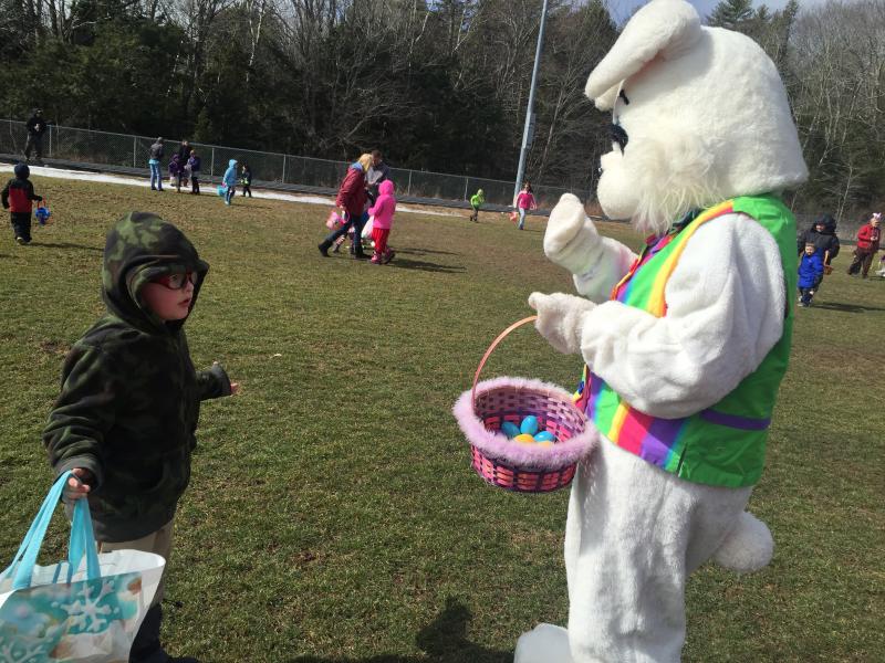 The Easter Bunny tries to answer a question from Wiscasset’s C.J. Marcoux during the hunt. SUSAN JOHNS/Wiscasset Newspaper