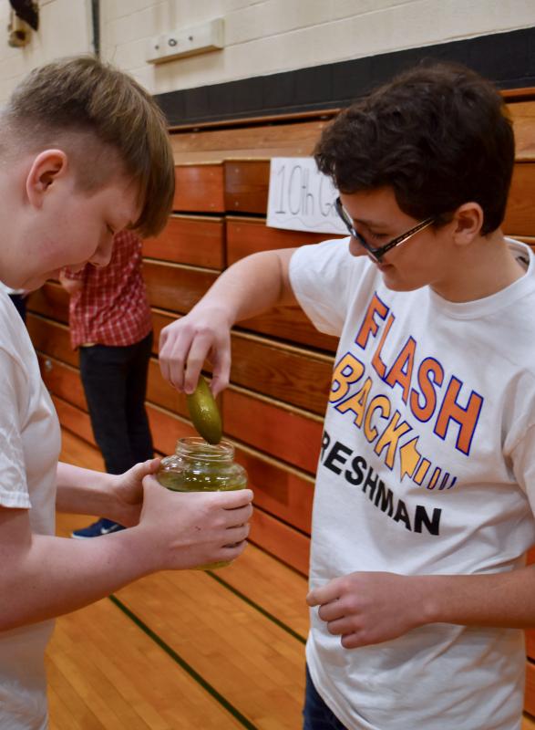 Johnny Spies, right, at the start of the pickle spitting contest. Kyle Ricker is holding the jar. PHIL DI VECE/Wiscasset Newspaper