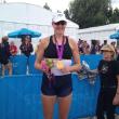 Ellie Logan proudly displays her gold medal, Olympics, rowing, elle logan