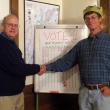 Board President John Atwood, left, congratulates John Wentzel, right, for winning the chili competition at the Sheepscot Valley Conservation Association November 9. Courtesy of Sheepscot Valley Conservation Association 