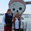 Alan and Judith Boyes try out their pirate gear ahead of Wiscasset's Fourth of July festivities. The harbor behind them, near the Wiscasset Yacht Club, will be the scene of a pirate attack, slated for 11:45 a.m. Thursday. SUSAN JOHNS/Wiscasset Newspaper