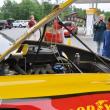 Nathaniel Mann, right, gets a look at the No. 22 Shell/Pennzoil Ford Fusion at Lil' Mart in Wiscasset.