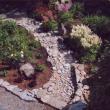 Aerial view from the bridge, showing the gardens divided by a dry river bed of stone constructed by Carlton Plummer. Courtesy of Carlton Plummer