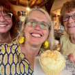 From left, Christine Buckley, Patrisha McLean, and Mary Lou Smith enjoying a yellow taste treat at the 2024 “Into the Light!” Foodie Festival that raised $28K for Finding Our Voices. 