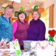 A few of the Boothbay Region Garden Club elves, from left: Kevin Bowler, Irene Gerny and Karen Iliades.  LISA KRISTOFF/Boothbay Register