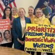 Governor Janet T. Mills standing in solidarity with domestic abuse survivors from Finding Our Voices, from left: Bethany McInnis, Nicole Bernhardt, Lisa Perry, Kerry Zabicki, Patrisha McLean, and Agnes Brackett. Jordan Merrifield photo