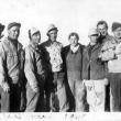 In 1945, these German POWs posed with the owner of a farm near Houlton where they worked. Note the prisoner holding one of the farm cats. Courtesy of Old Bristol Historical Society 