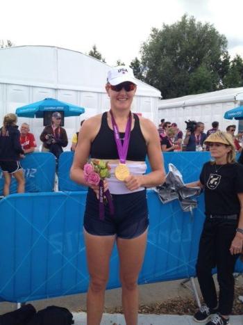 Ellie Logan proudly displays her gold medal, Olympics, rowing, elle logan