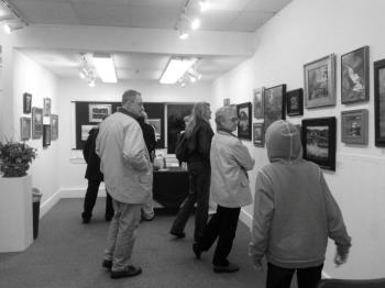 Art patrons visit the first-ever Plein Air Art Exhibit at the Boothbay Region Art Foundation Gallery. Courtesy of Corinne McIntyre