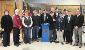 Front, left to right: Mary Fish (Unit 42 President), Mary Jane McLoon (ALA Dept. ME President), Kaye Bouchard (Legion Riders Exec. Director), James Herald (Cdr. SAL Squad. 42),  Area 3 Rep. Dan Boland, PNVC Wm. “Chick” Ciciotte, Jerry Elwell (Distr. 7 Sgt. at Arms), Paul Herald (Distr. 7 Cdr.), William J. Cossette Jr. (Post 54 Service Officer/2nd Vice Cdr.). 