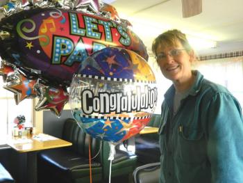 Ship's Chow Hall owner Tina Fitzsimmons receives congratulations and balloons from her customers on winning the former Huber’s Market property in a public auction January 29. CHARLOTTE BOYNTON/Wiscasset Newspaper