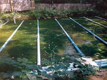 This open sand filter bed used cross-sectioned pipes to filter effluent that was pumped uphill from the former Montsweag Farms restaurant. A septic system that was built in 1977 had a number of problems, according to town documents, and had to be put out of use. Courtesy of Woolwich Town Office