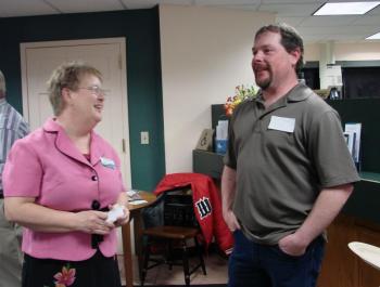 Wiscasset's Vickie Hersom, left, manager of the Bank of Maine's Wiscasset branch, chats with Grover Construction Inc. owner Chet Grover of Wiscasset April 17. The bank was hosting a Wiscasset Area Chamber of Commerce event. SUSAN JOHNS/Wiscasset Newspaper