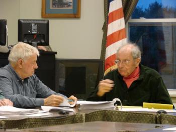 Wiscasset Budget Committee member Norman Guidoboni, right, gestures to fellow member Ray Soule to say “Woolwich” for him. SUSAN JOHNS/Wiscasset Newspaper