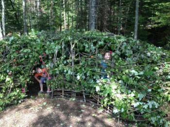 Maeve and Ronan Cullina enjoy the new twig tunnel in the Children's Garden at Coastal Maine Botanical Gardens. The tunnel, a group project led by artisan-in-residence Susan Perrine, will remain throughout the summer and beyond. For information about upcoming children's programs, visit www.mainegardens.org, or call 207-633-4333, ext. 101. Courtesy of Melissa Cullina