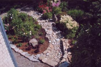 Aerial view from the bridge, showing the gardens divided by a dry river bed of stone constructed by Carlton Plummer. Courtesy of Carlton Plummer