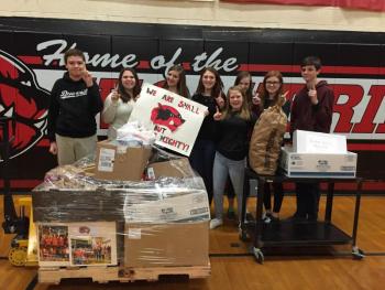 Wiscasset Middle High School students prepare for Good Shepherd Food Bank’s final Wiscasset food pick-up on Monday, March 1. Pictured in front is Maeve Blodgett. Back row, from left, are Ben Masten, Corey Campbell, Lindsey Gordon, Vanessa Dunn, Grace Webber, Sarah Foley and Jesse Perkins. Courtesy of Deb Pooler