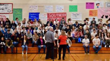 Warren Cossette and Deb Pooler address the WMHS student body at the start of the Winter Carnival. PHIL DI VECE/Wiscasset Newspaper