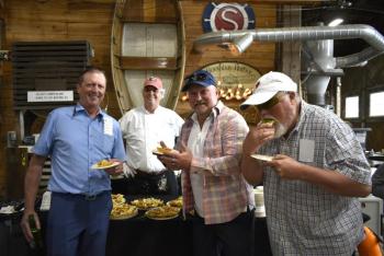 Rick Carmolli, Mark Gimbel, and Doug Gimbel at the Mine Oyster table. That’s Chef Ralph Smith behind the table. LISA KRISTOFF/Boothbay Register