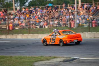 Zach Audet does a victory lap following his win in the Thunder 4 Minis. Jasen Dickey Photography