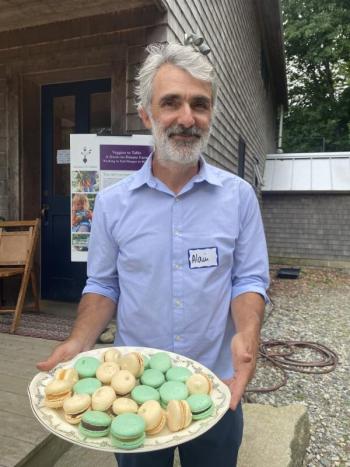 Alain Ollier with macaron. Photo Erica Berman