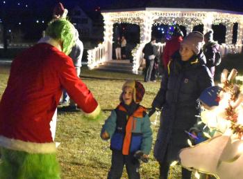 Boy meets the Grinch on the Boothbay Common. LISA KRISTOFF/Boothbay Register