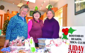 A few of the Boothbay Region Garden Club elves, from left: Kevin Bowler, Irene Gerny and Karen Iliades.  LISA KRISTOFF/Boothbay Register