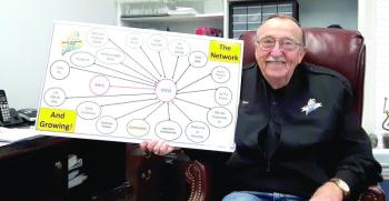 David Patch CDR/USN (Ret) holds a chart showing entities Maine Veterans in Need works with to provide emergency help for Maine veterans. JANE CARPENTER/Boothbay Register