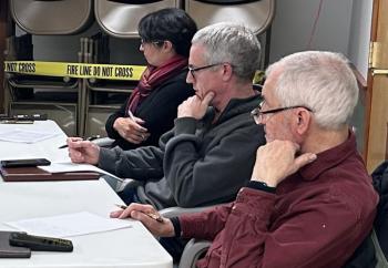 From left: Alna Select Board members Coreysha Stone, Nicholas Johnston, and Steven Graham listen to residents discuss a proposed blasting ordinance. Residents raised concerns about the effects of blasting on groundwater. The select board will discuss a final version of the ordinance, to be considered by voters at Alna's town meeting this March, at their next meeting. Molly Rains photo