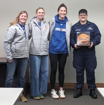 Team seniors honor Laroche-Albert with a signed basketball. CANDI JONETH/Boothbay Register