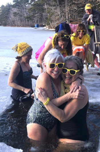 Hugging at 2024’s Wander Women’s dip in Union are Carla Armbuster and Carol Miller. In back, left to right , are Cathy Kelly, Kerry Hadley, Emily Peckham, and Laura Cabot. This year's event will be held on Feb. 9.  Photo by Erja Lipponen