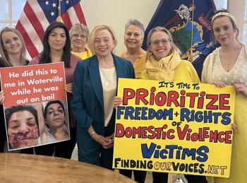 Governor Janet T. Mills standing in solidarity with domestic abuse survivors from Finding Our Voices, from left: Bethany McInnis, Nicole Bernhardt, Lisa Perry, Kerry Zabicki, Patrisha McLean, and Agnes Brackett. Jordan Merrifield photo