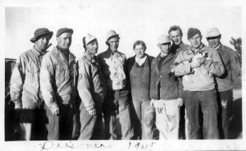 In 1945, these German POWs posed with the owner of a farm near Houlton where they worked. Note the prisoner holding one of the farm cats. Courtesy of Old Bristol Historical Society 