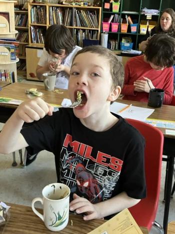 Bear Hamlin tastes the pesto pasta. Becky Hallowell photo 