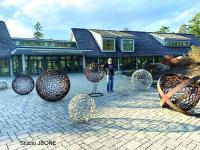 Jay "JBONE" Sawyer of Warren and a few of his spheres in his "Spiritual Influence" installation at CMBG. 