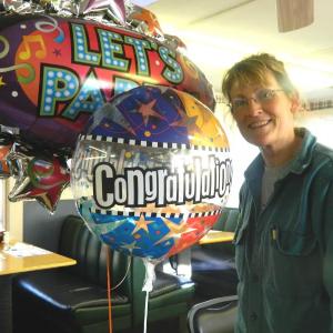 Ship's Chow Hall owner Tina Fitzsimmons receives congratulations and balloons from her customers on winning the former Huber’s Market property in a public auction January 29. CHARLOTTE BOYNTON/Wiscasset Newspaper