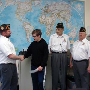 Bath View Post 7738 Junior Vice Cmdr. Kenneth Lambert, left, hands David Marcus an $800 check on April 26. Post Cmdr. Arthur Edwards and Quartermaster Tom Rainey look on. SUSAN JOHNS/Wiscasset Newspaper