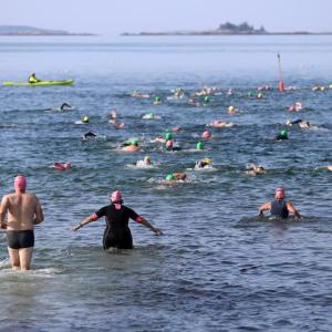 Swimmers plunge into the water at the start of the 2024 Pemaquid Beach Triathlon. Kris Christine photo Swimmers plunge into the water at the start of the 2024 Pemaquid Beach Triathlon. Kris Christine photo