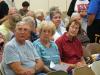 Ira and Connie Machon, along with Sharon Barter, listen to the discussion at the meeting.