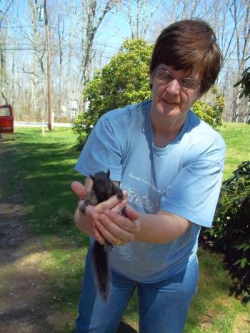 Betsy Pratt and the baby squirrel. SUZI THAYER/Boothbay Register