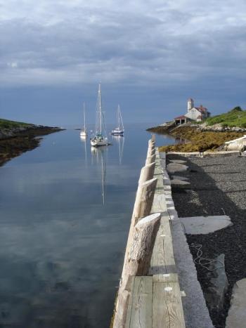 Boats mooring in Damariscove Harbor near the renovated stone pier. Damariscove is one of six boat accessible preserves and one of two working waterfront sites owned by BRLT. The land trust is raising money to sustain its boat access, working waterfront, hiking trails and education programs.